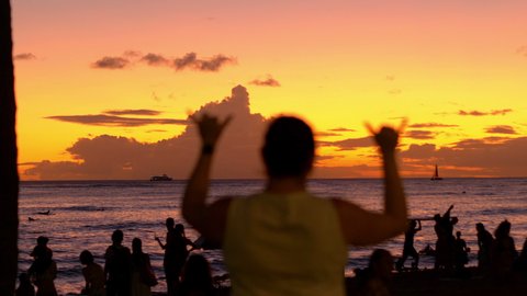 Woman Showing The Shaka hawaii love symbol at sunset in 4K Slow motion 60fps