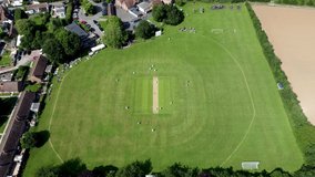 4K drove video clip of a perfect English summers day of village cricket.