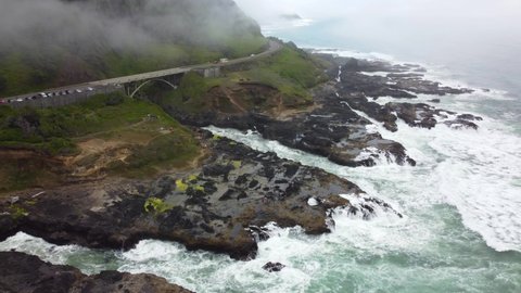 4K 30FPS Aerial Footage of Thor's Well - Tracking Back Flying Shot - Aerial View of Pacific Coast and Ocean - Turquoise Blue Water, Mossy Rock, Highway Route 101, Clouds - Smooth DJI Drone Video