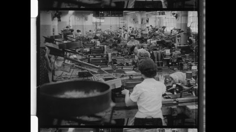 1960s Pittsburgh, PA. Women work in Factory assembling Industrial Machine Parts. 4K Overscan of Vintage Archival Black and White 16mm Film Footage 