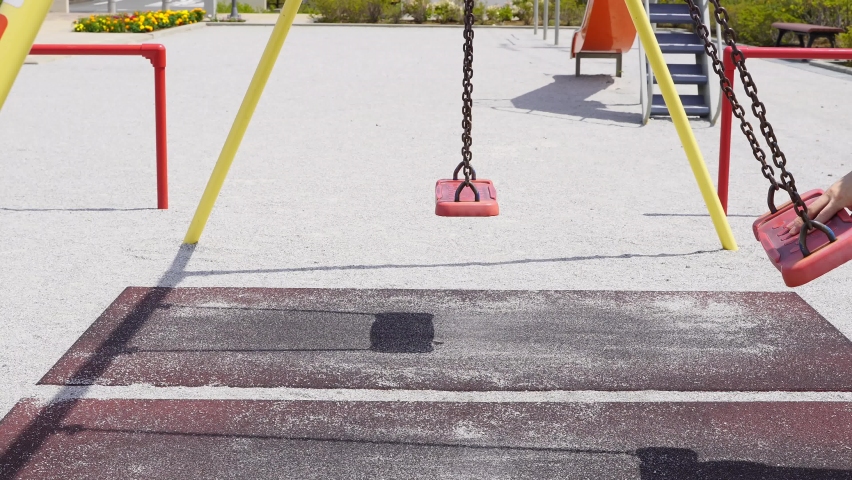 Swing a swing in the park. Like a metronome 