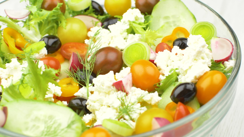 delicious mixed salad with cucumber,tomatoes,black olives and feta cheese