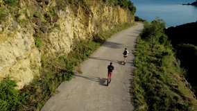 Man and Woman on the Electric Scooter Aerial Follow Scene in 4K UHD Aerial Drone Shot. - Powered by Shutterstock - Get 15% off with code: PIKWIZARD15