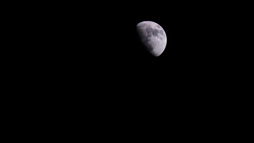Moon at night on dark black sky. Dolly shot, a Nature Video by Anetlanda