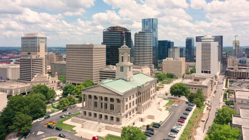 Aerial view of Nashville skyline with slow rotation around the State Capitol. Nashville is the capital and most populous city of Tennessee, and a major center for the music industry | Shutterstock HD Video #1075908845