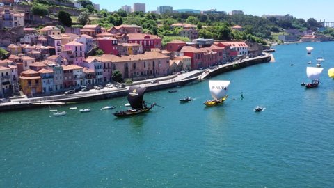 Porto , Portugal - 06 30 2021: Rabelo Boats Of Fonseca And Dalva Cruising Douro River Near The Embankment Of Vila Nova de Gaia