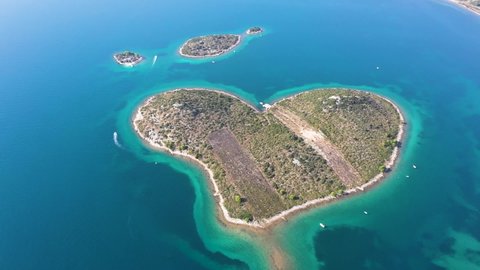 Aerial view of the beautiful Galešnjak, Island of Love, Lover's Island, Otok za Zaljubljene, Love Island, Heart shaped Island in the Adriatic Sea in Croatia. Drone shot.