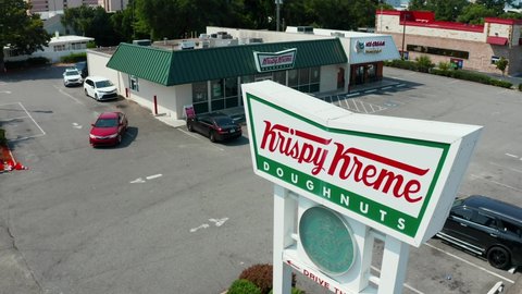 Myrtle Beach , SC , United States - 06 15 2021: Krispy Kreme Doughnut restaurant store. Aerial of drive through retail location.