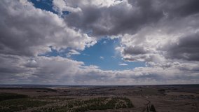 Blue sky white clouds background timelapse. Beautiful weather at cloudy heaven. Beauty of bright color, light in summer nature. Abstract fluffy, puffy cloudscape in air time lapse. Video loop
