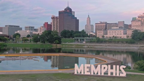 Aerial: The MEMPHIS Sign on Mud Island River Park. In the background is Downtown Memphis, Tennessee, USA. 26 June 2019