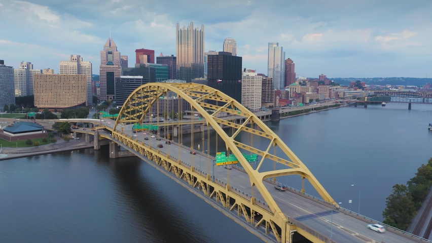 Aerial: Rush hour traffic on the Fort Pitt Bridge that crosses the Monongahela River. In the background is downtown Pittsburgh skyline. Pennsylvania, USA | Shutterstock HD Video #1075923731