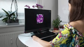 A woman, graphic designer, illustrator is using the graphic tablet, creating the graphic design, fabric pattern on a graphic tablet. Working remotely from the home. Creative occupation concept. - Powered by Shutterstock - Get 15% off with code: PIKWIZARD15