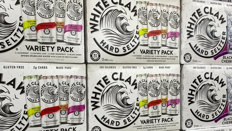 Orlando, FL - USA February 6, 2021: Panning down on cases of White Claw Hard Seltzer at a Sams Club store.