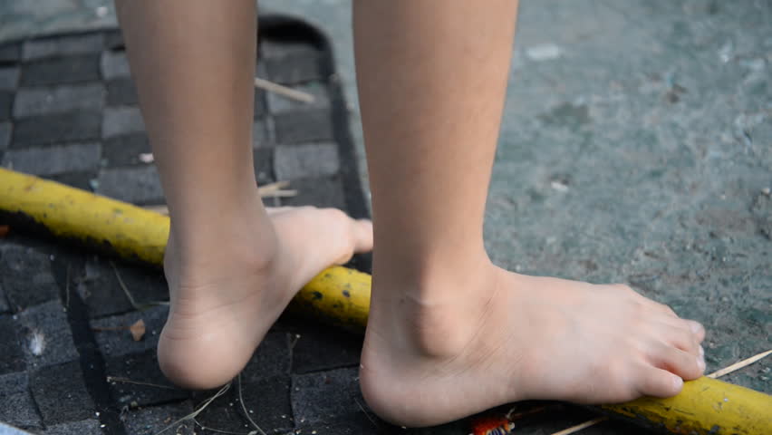 Little boy climbing up at playground