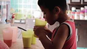 closeup clip of kids drink milk at the house