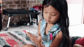 view of a kids played mobile game on smartphone