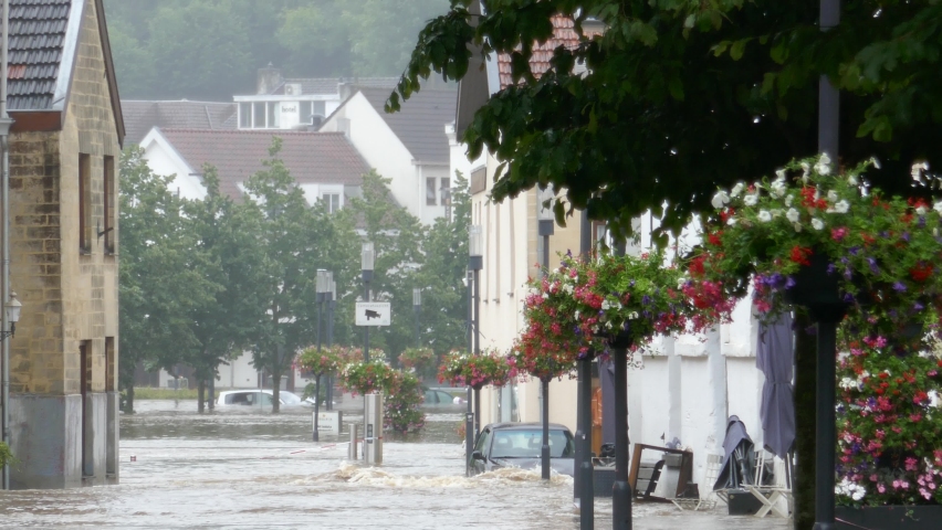 Netherlands - 15 july 2021, Valkenburg: Flooding after heavy rain in the province of South Limburg - heavy rain on street, flooded cars
