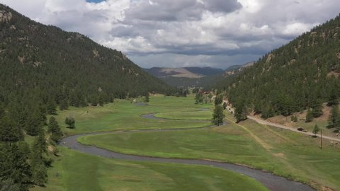 4K UHD video aerial flyover of the  North Fork of South Platte River in Pike National Forest, Colorado, USA
