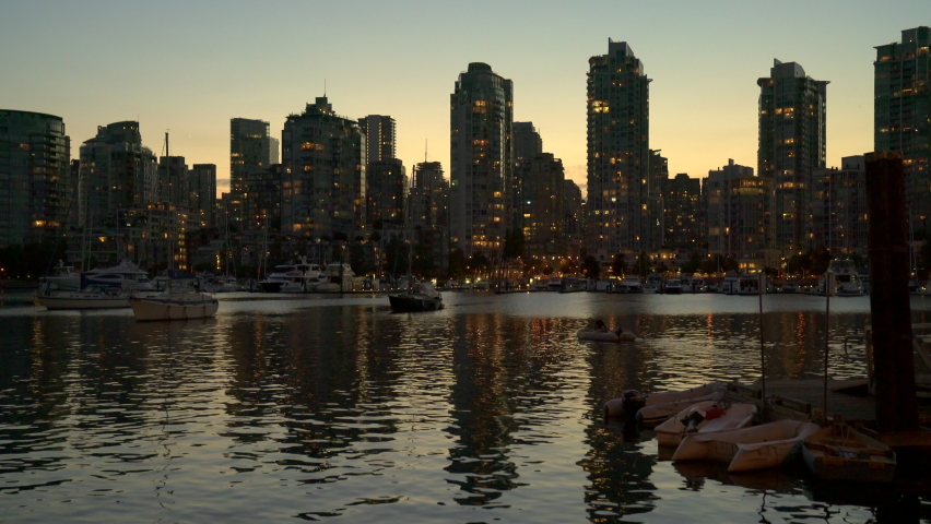 Yaletown Vancouver Skyline Dusk 4K UHD. The view of Yaletown across False Creek at sunset in Vancouver. British Columbia, Canada.
