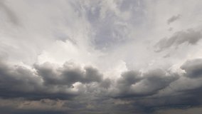 Dramatic cloudscape nature background. Timelapse cloudscape 4k b roll footage. Darkness covers bright sky. Rainy weather forecast. Gray clouds rainstorm sky. Panoramic view of fast moving weather 
