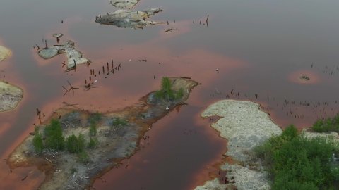 red polluted water aerial view. chemical pollution, lack of clean drinking water. environmental problems - unsafe water with chemicals. Industrial and agricultural work polluting water