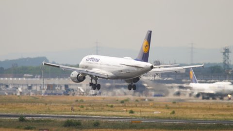 FRANKFURT AM MAIN, GERMANY - JULY 21, 2017: Lufthansa Airbus 320 landing on runway at Fraport, Frankfurt, Germany