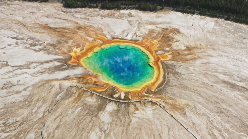 Yellowstone National Park, Wyoming USA. Aerial view of Grand Prismatic Hot Spring in Yellowstone National Park, shot from helicopter. Cinematic vibrant colorful blue, green orange ancient volcano lake Royalty-Free Stock Footage #1075997111