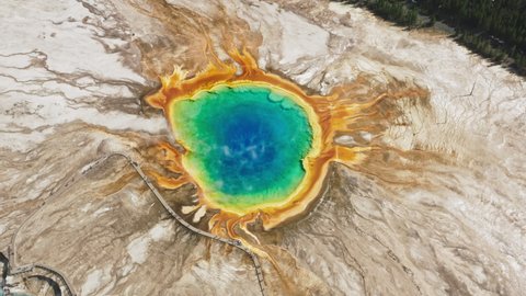 Yellowstone National Park, Wyoming USA. Aerial view of Grand Prismatic Hot Spring in Yellowstone National Park, shot from helicopter. Cinematic vibrant colorful blue, green orange ancient volcano lake