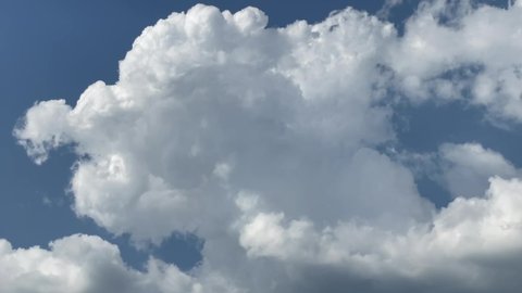 Cumulus, White clouds on the blue summer sky on a sunny day, clouds movement. Fluffy cloud mass, cotton clouds background, deep blue sky. 4k video 