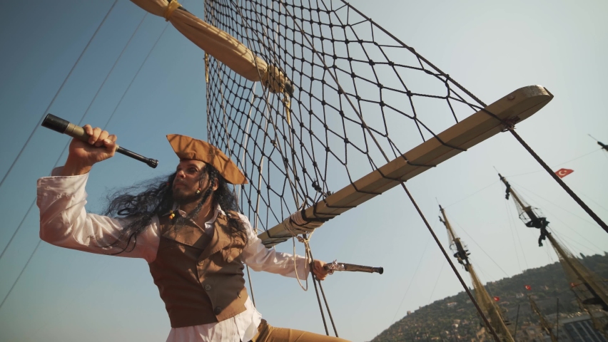 Portrait of man in a pirate costume on a pirate ship Royalty-Free Stock Footage #1076011001
