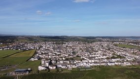 Aerial Drone Footage as we fly over  Porthcawl near Rest Bay. The beautiful scenery of South Wales in 4K. UK.