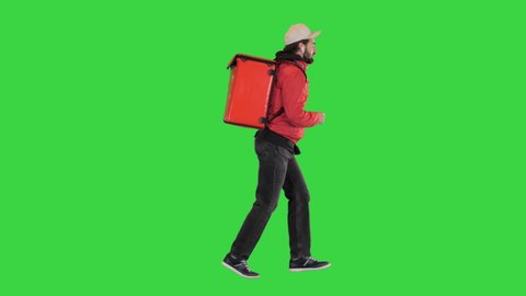 Delivery man running with thermo backpack on a Green Screen, Chroma Key.