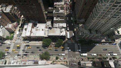 An extreme wide top down shot of a busy Manhattan street during the day.  	