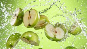 Super slow motion of fresh green apples flying in the air. Filmed on high speed cinema camera, 1000 fps. - Powered by Shutterstock - Get 15% off with code: PIKWIZARD15