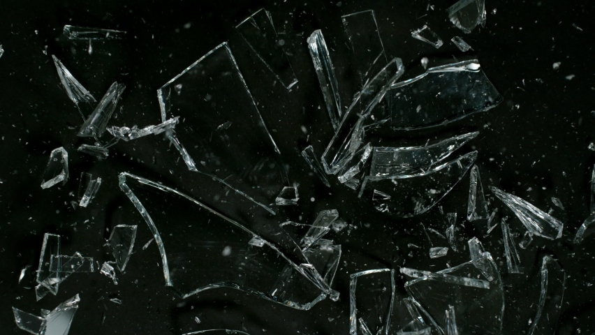 Super Slow Motion Shot of Real Glass Break at 1000 fps. Isolated on Black Background.