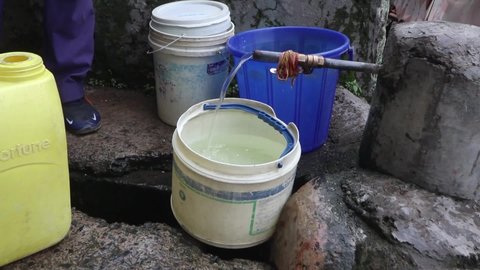 New Delhi, India, July 17, 2021: A plastic container fill with drinking water in summer, provided by Municipal Corporation of Jal Board, for slum 