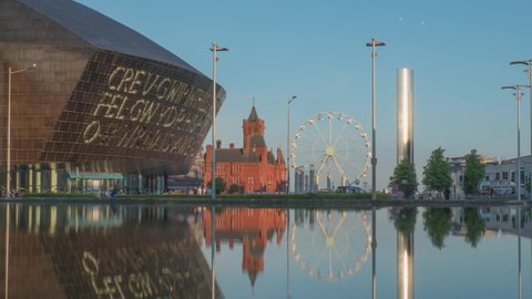 CARDIFF, WALES – May 30, 2021: Cardiff Bay, day to night time lapse featuring Millennium Centre, Pierhead, Roald Dahl Plass, The Flourish, UK