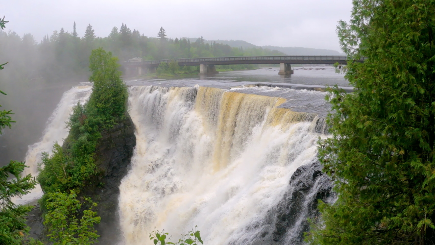 Kakabeka Falls Provincial Park is named for its scenic waterfall near Thunder Bay, Ontario, Canada, Trans-Canada Highway bridge is in the background