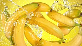 Super Slow Motion Shot of Flying Fresh Bananas and Water Side Splash. - Powered by Shutterstock - Get 15% off with code: PIKWIZARD15