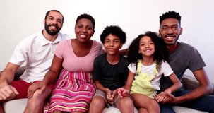 Mixed race family speaking in video long distance communication. interracial couple and kids