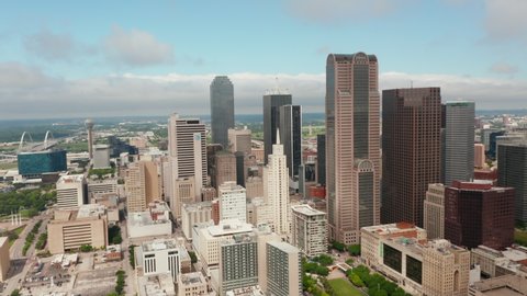 Aerial view of tall modern office downtown buildings. Orbiting around group of skyscrapers. Dallas, Texas, US in 2021