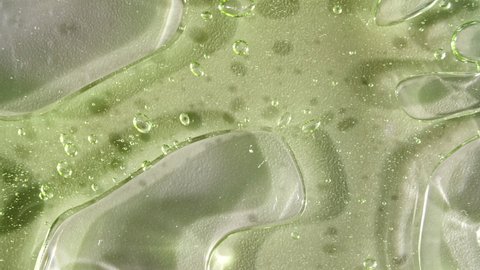 Transparent Green Cosmetic Gel Cream With Molecule Bubbles. Top view. Macro Shot