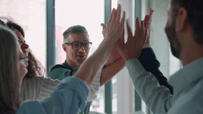 Happy diverse international company staff employees executive team people giving high five in slow motion. Success and leadership, business win, teambuilding collaboration, corporate teamwork concept - Powered by Shutterstock - Get 15% off with code: PIKWIZARD15
