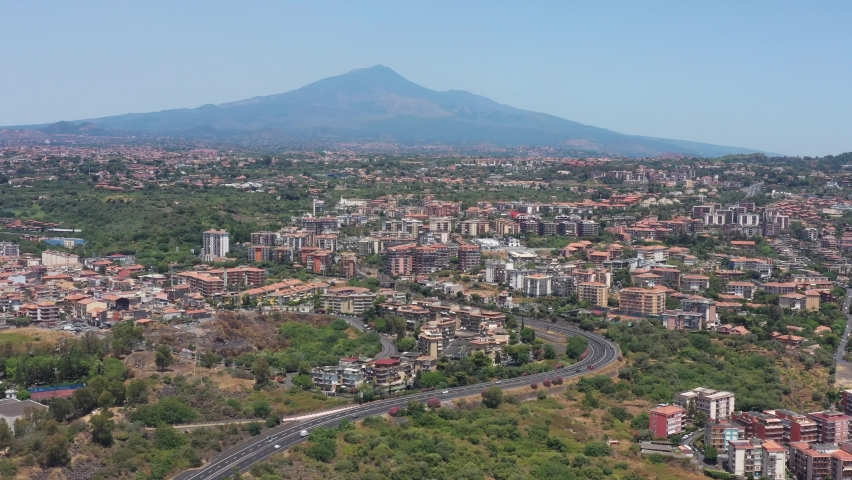 Catania, Sicily, Italy, drone aerial view above the city with Mount Etna volcano in the background Royalty-Free Stock Footage #1076059916