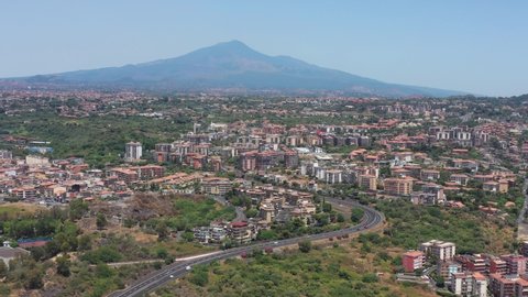 Catania, Sicily, Italy, drone aerial view above the city with Mount Etna volcano in the background
