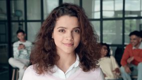 Headshot portrait of young happy smiling Latin Hispanic high school student girl holding backpack standing in modern college university high school campus. Education concept. - Powered by Shutterstock - Get 15% off with code: PIKWIZARD15