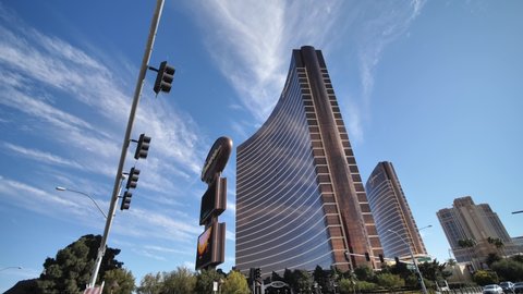 Las Vegas , Nevada , United States - 07 07 2021: Driving by Wynn Encore Hotel and Casino on Strip on Sunny Day, Left Side Car Window POV