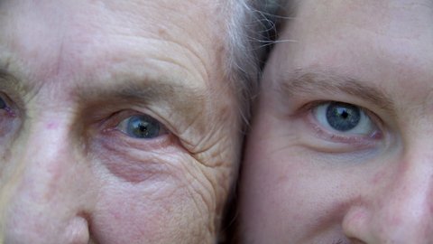 faces of relatives of an old woman and a young man, the same eyes and skin tone, similar wrinkles on the eyes, age difference of fifty years, half a century