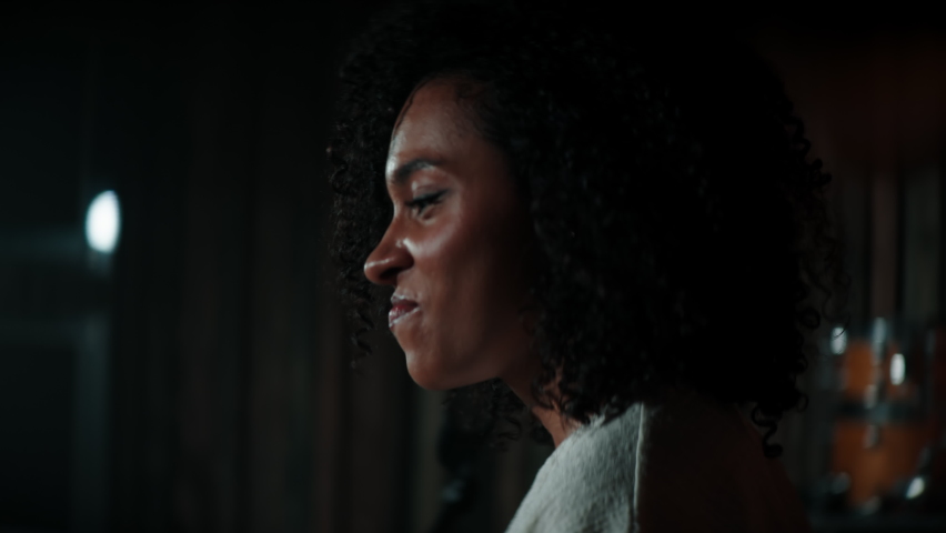 CU HANDHELD Portrait of Black African American young female comedian finishing her stand-up monologue and leaving stage of a small venue. Shot with ARRI Alexa Mini LF with 2x anamorphic lens Royalty-Free Stock Footage #1076099774