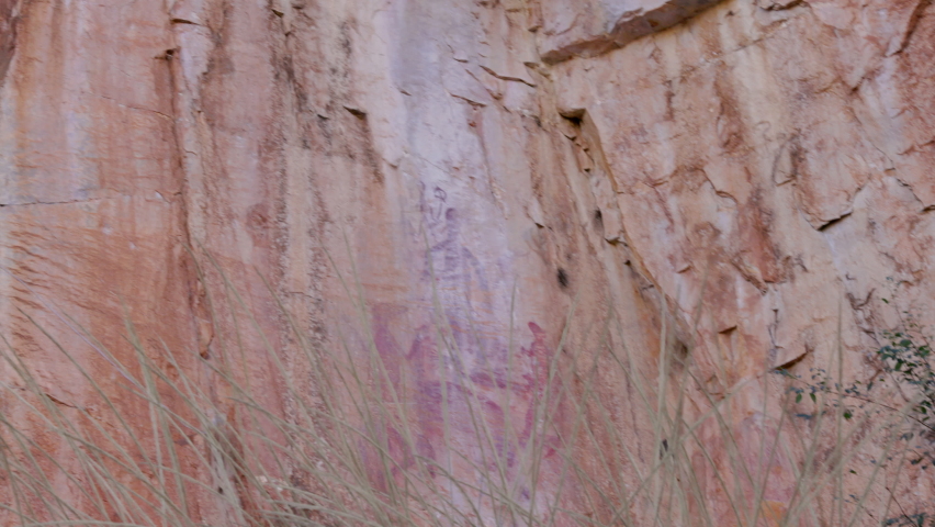 zoom in on aboriginal rock art at nitmiluk gorge, also known as katherine gorge, of nitmiluk national park in the northern territory Royalty-Free Stock Footage #1076108225